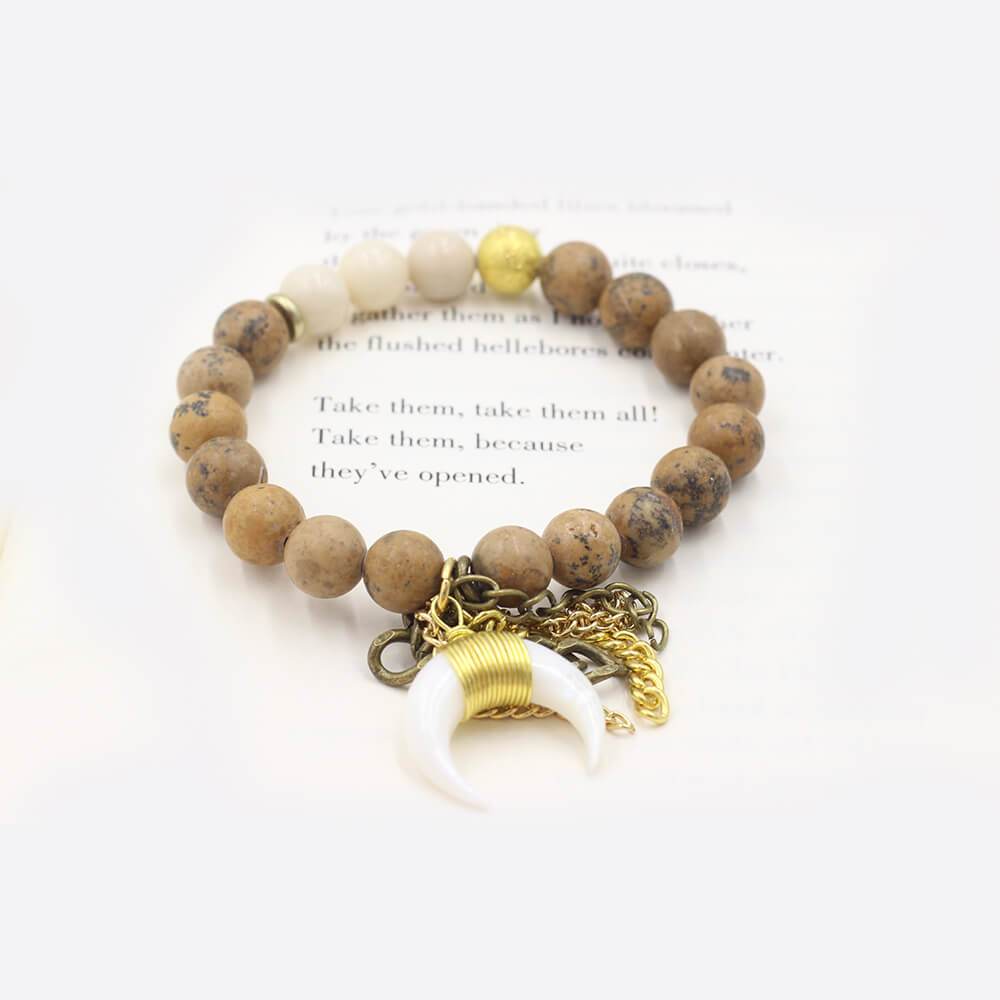 Susan Balaban Designed Healing Bracelet - This neutral tan healing yoga bracelet features jasper and a horn charm for reconnecting to the wild spirit.